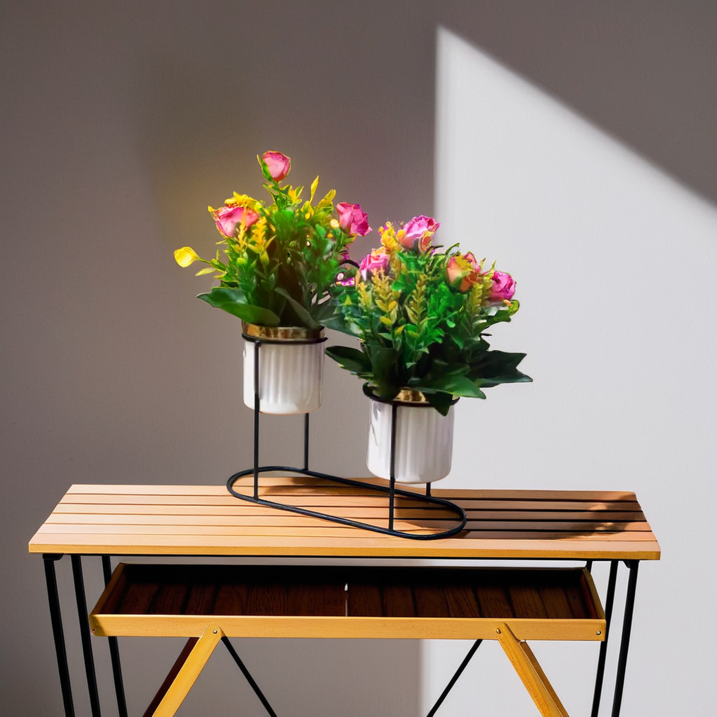 Two potted plant with pink and yellow flower