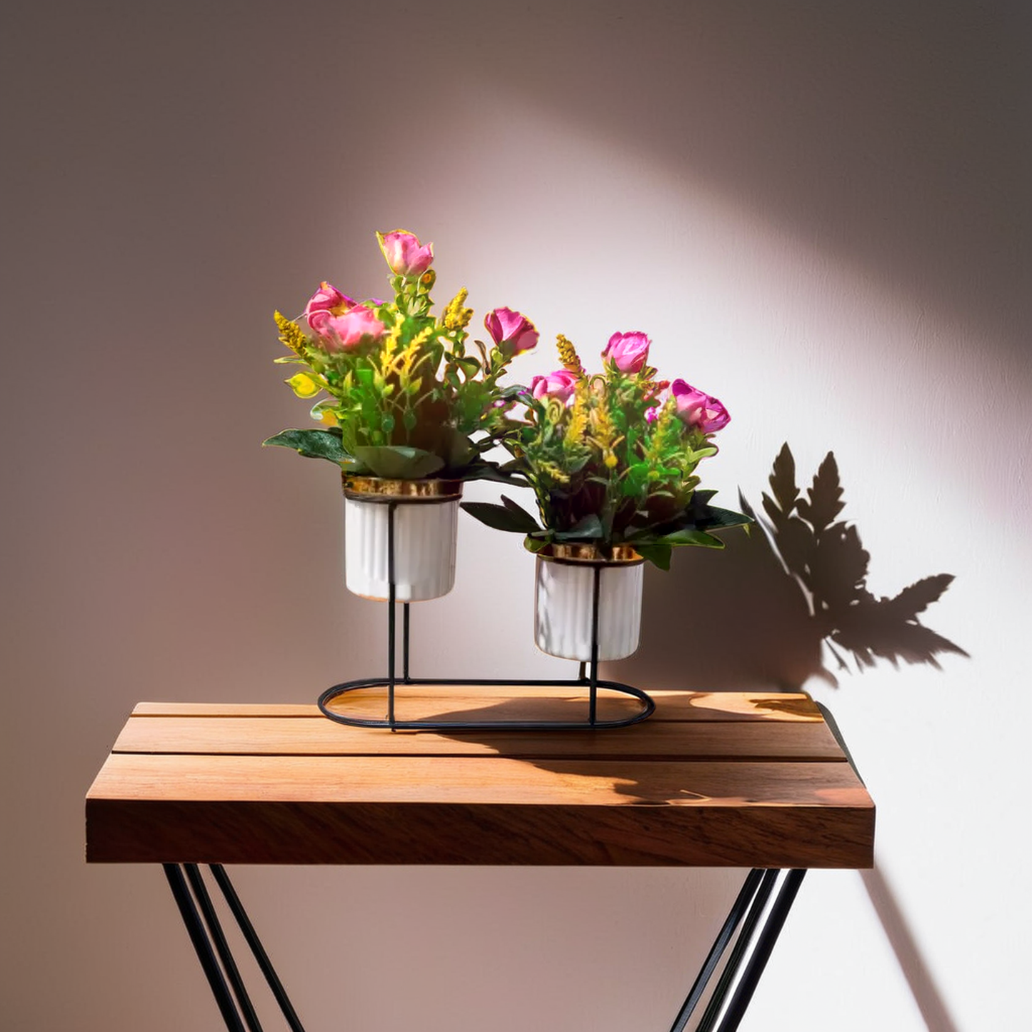 Two potted plant with pink and yellow flower